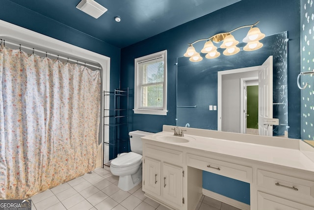 full bathroom featuring tile patterned floors, toilet, vanity, and a shower with curtain