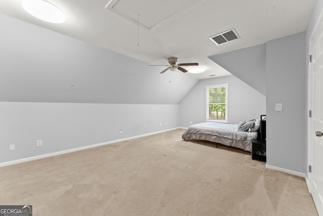 bedroom with attic access, carpet, lofted ceiling, baseboards, and ceiling fan