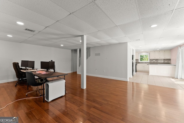 office with light wood-type flooring, baseboards, and recessed lighting