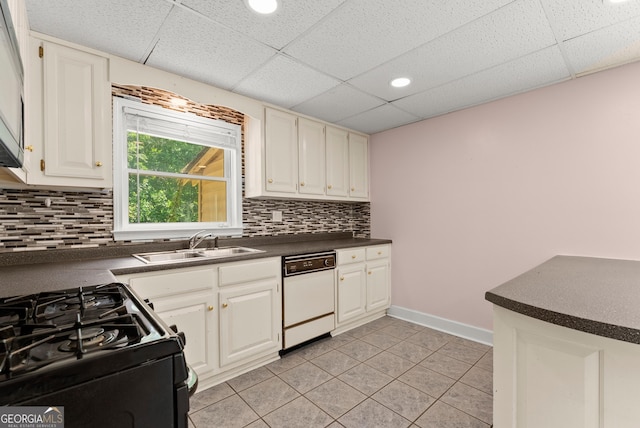 5103 Whispering Pines Dr, Gainesville, GA 30504 - kitchen with white dishwasher, a paneled ceiling, dark countertops, light tile patterned flooring, and black range with gas cooktop