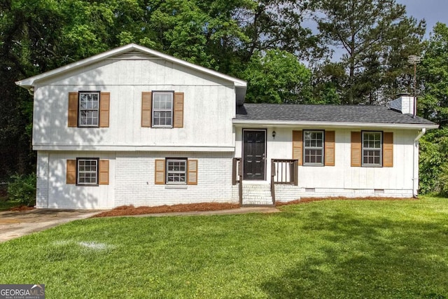 315 Henson Cir, Carrollton, GA 30117 - tri-level home featuring crawl space, a front yard, a chimney, and brick siding