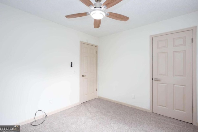 315 Henson Cir, Carrollton, GA 30117 - unfurnished room featuring carpet floors, a ceiling fan, and baseboards