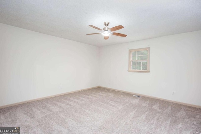 315 Henson Cir, Carrollton, GA 30117 - empty room featuring carpet floors, ceiling fan, and baseboards