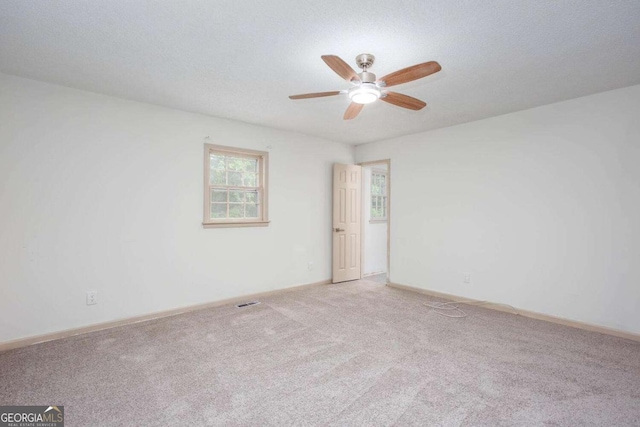 315 Henson Cir, Carrollton, GA 30117 - unfurnished room featuring a ceiling fan, carpet floors, and baseboards