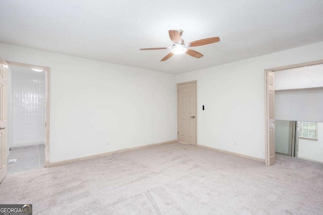 315 Henson Cir, Carrollton, GA 30117 - unfurnished bedroom featuring carpet, baseboards, ensuite bathroom, and ceiling fan