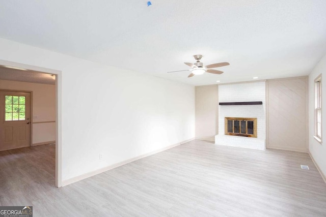 315 Henson Cir, Carrollton, GA 30117 - unfurnished living room with wood finished floors, a ceiling fan, baseboards, a fireplace, and recessed lighting