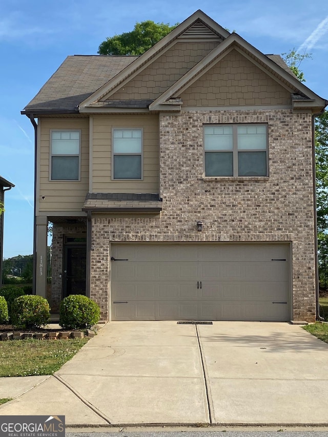 11813 Lovejoy Crossing Blvd, Hampton, GA 30228 - view of front of home featuring a garage, brick siding, and driveway