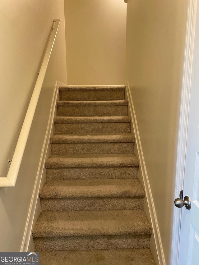 11813 Lovejoy Crossing Blvd, Hampton, GA 30228 - staircase with carpet floors