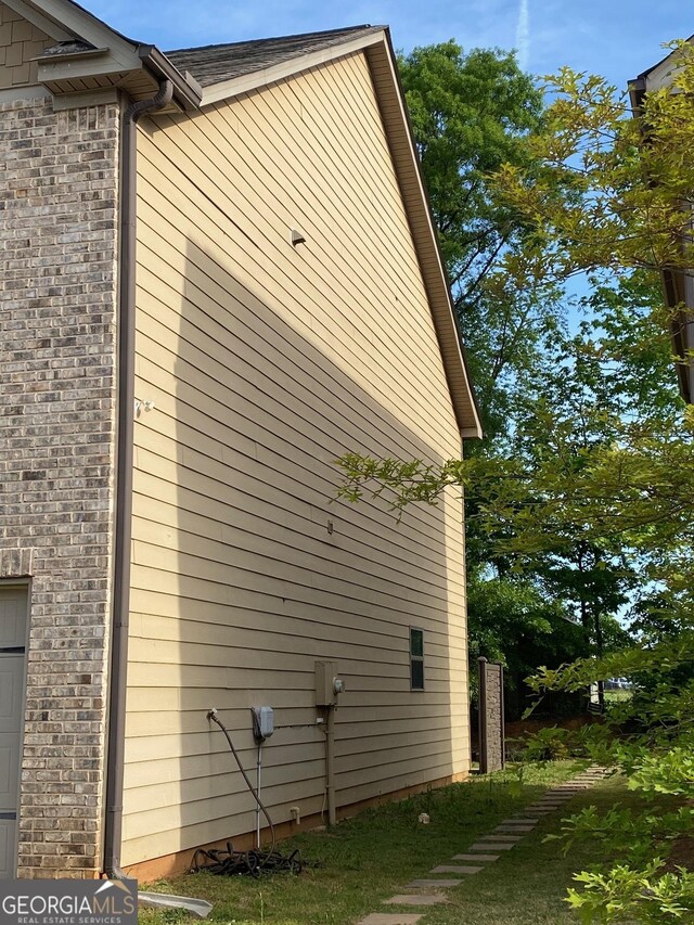 11813 Lovejoy Crossing Blvd, Hampton, GA 30228 - view of side of home featuring brick siding