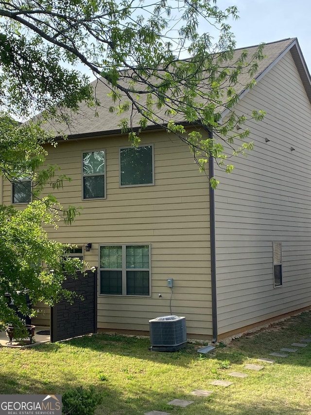 11813 Lovejoy Crossing Blvd, Hampton, GA 30228 - back of property with central AC and a lawn