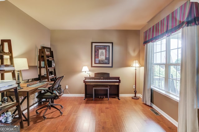 5960 Bridge Stone Ct, Cumming, GA 30028 - home office featuring plenty of natural light, wood finished floors, and baseboards