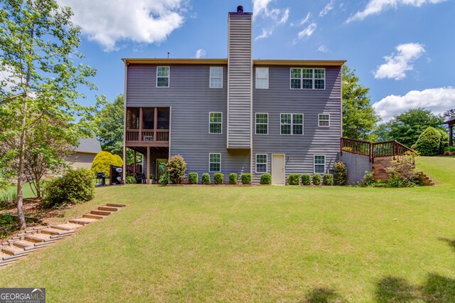5960 Bridge Stone Ct, Cumming, GA 30028 - back of property with a yard and a chimney