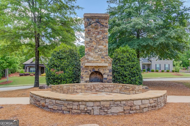 5960 Bridge Stone Ct, Cumming, GA 30028 - view of patio with an outdoor stone fireplace