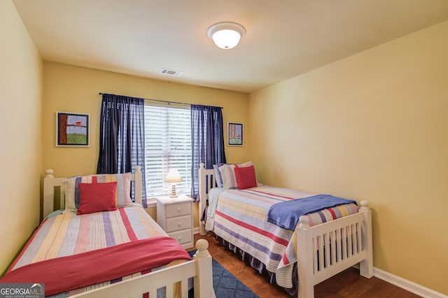 5960 Bridge Stone Ct, Cumming, GA 30028 - bedroom featuring wood finished floors and baseboards