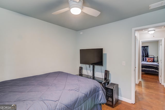 5960 Bridge Stone Ct, Cumming, GA 30028 - bedroom with wood finished floors, attic access, baseboards, and ceiling fan