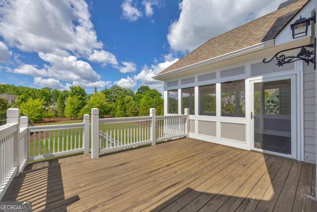wooden terrace with a sunroom