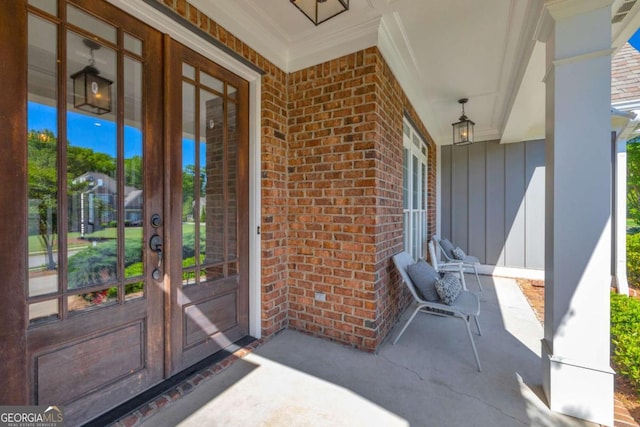 view of patio featuring french doors and a porch