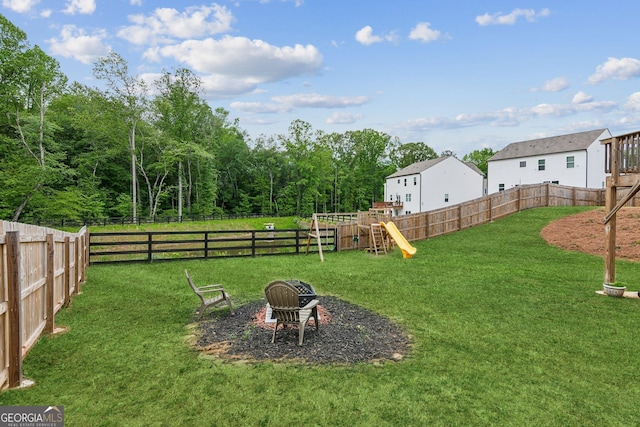 42 Waterfall Ct, Dawsonville, GA 30534 - fenced backyard with a playground
