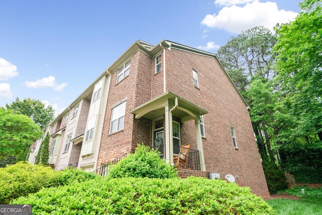 view of home's exterior featuring brick siding