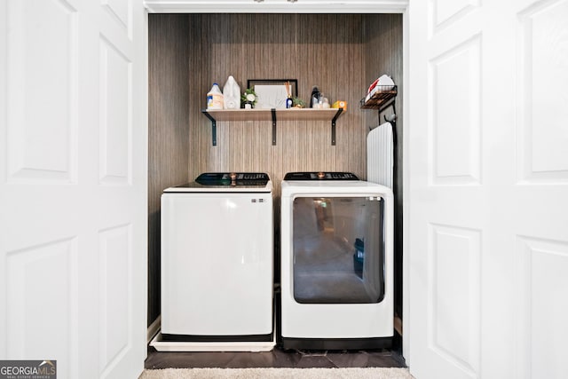 clothes washing area featuring separate washer and dryer