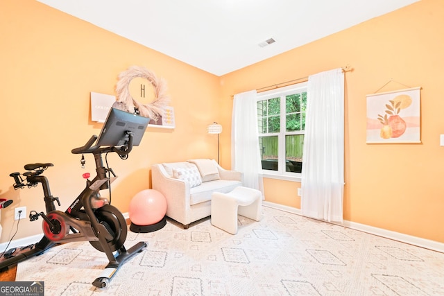 workout area featuring baseboards