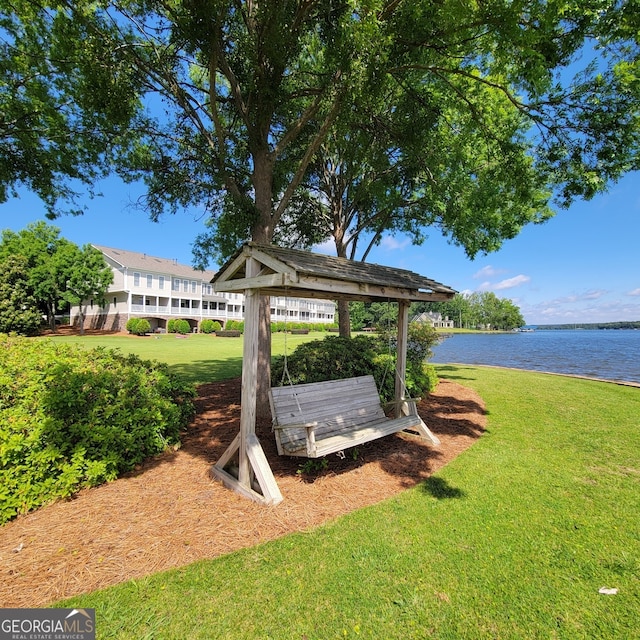 175 Lakeview Dr Apt 102, Eatonton, GA 31024 - view of community featuring a water view and a lawn