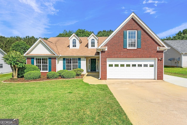 traditional-style home featuring concrete driveway, a front yard, brick siding, and an attached garage