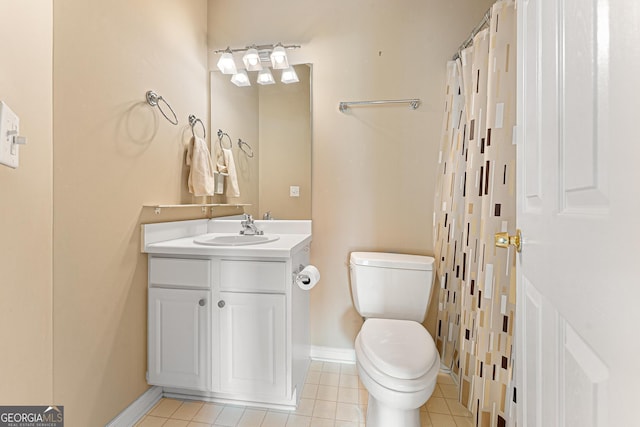 full bath featuring toilet, baseboards, vanity, and tile patterned floors