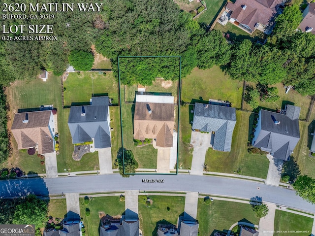 aerial perspective of suburban area featuring property boundaries highlighted