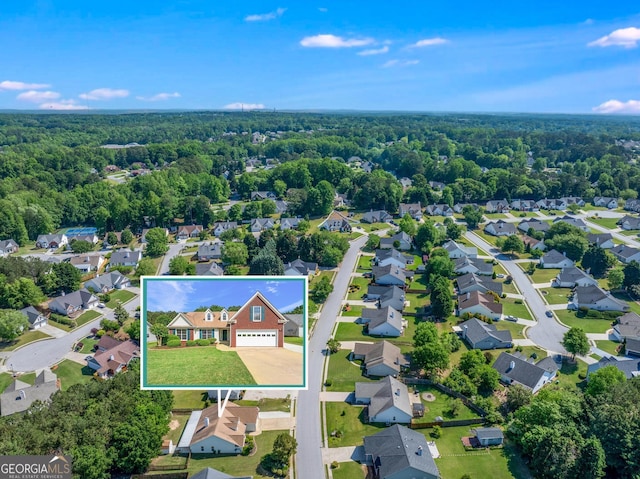 aerial perspective of suburban area with a forest and property boundaries highlighted