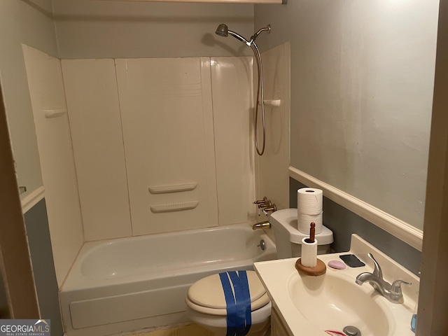 bathroom featuring a sink, toilet, and washtub / shower combination