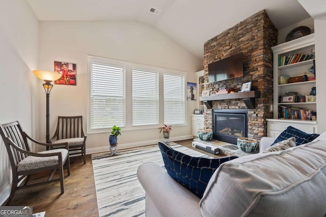 170 Oakleigh Manor Dr, Fayetteville, GA 30215 - living area featuring wood-type flooring, lofted ceiling, a fireplace, and baseboards