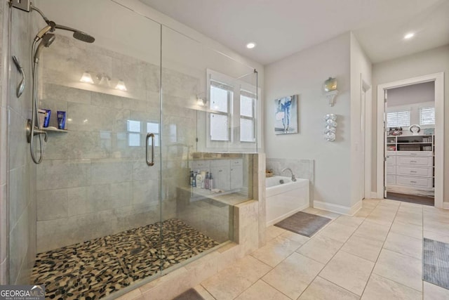 170 Oakleigh Manor Dr, Fayetteville, GA 30215 - full bathroom featuring a shower stall, a garden tub, tile patterned floors, recessed lighting, and baseboards