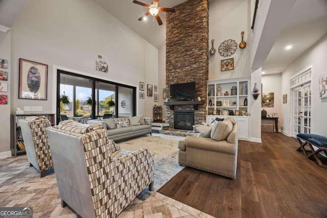 170 Oakleigh Manor Dr, Fayetteville, GA 30215 - living area featuring high vaulted ceiling, ceiling fan, a fireplace, baseboards, and wood finished floors