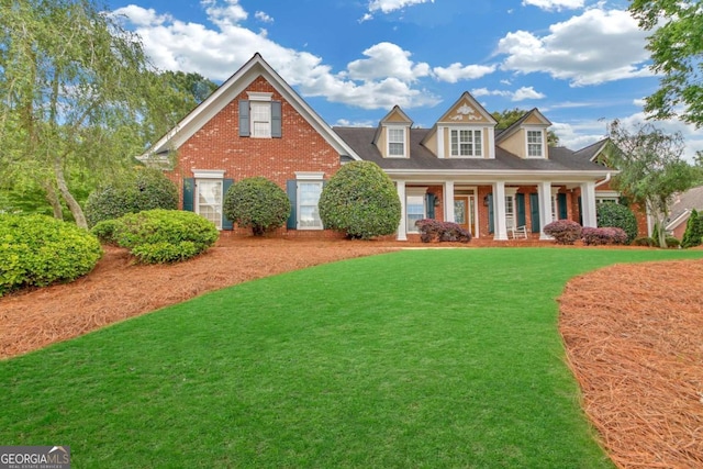 328 Broadmoor Way, Mcdonough, GA 30253 - view of front of property featuring brick siding, a front lawn, and covered porch