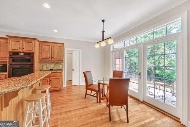 328 Broadmoor Way, Mcdonough, GA 30253 - dining area with crown molding, a chandelier, light wood-type flooring, and recessed lighting