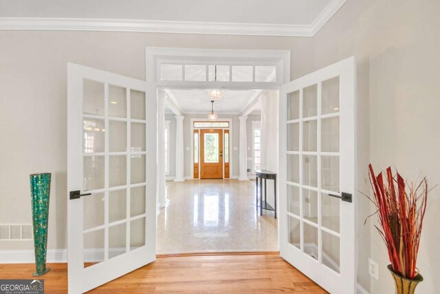 328 Broadmoor Way, Mcdonough, GA 30253 - entryway with french doors, crown molding, a chandelier, and baseboards