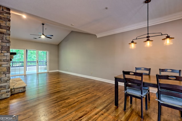dining area with ceiling fan, wood finished floors, lofted ceiling, baseboards, and crown molding