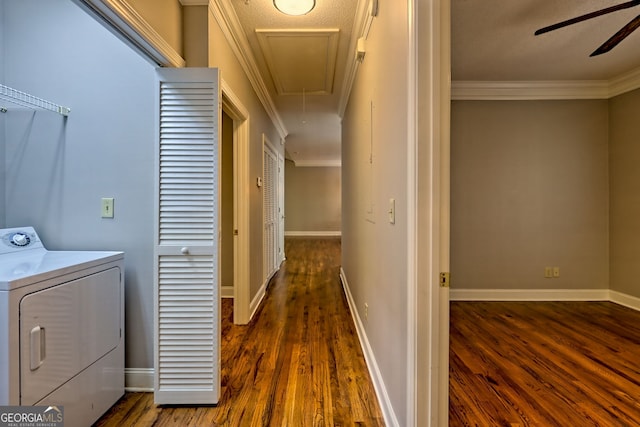 laundry area featuring washer / dryer, attic access, wood finished floors, and ornamental molding