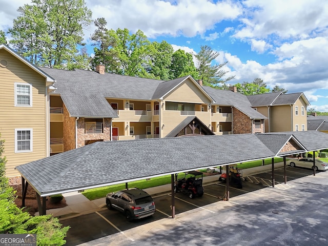 112 Glen Eagle Ct Unit 303, Clayton, GA 30525 - view of property with covered parking and a residential view