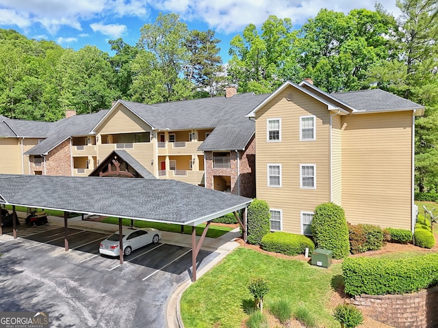view of property with covered parking