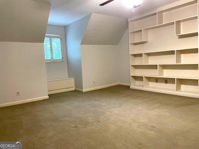 3132 Ingleside Ave, Macon, GA 31204 - bonus room with baseboards, dark carpet, a ceiling fan, and vaulted ceiling