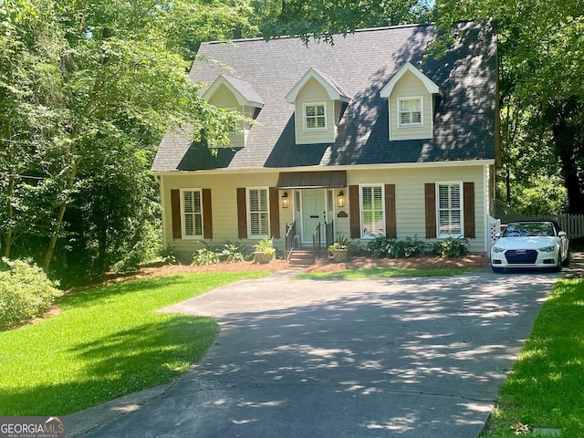 3132 Ingleside Ave, Macon, GA 31204 - new england style home with driveway, a front lawn, and a chimney