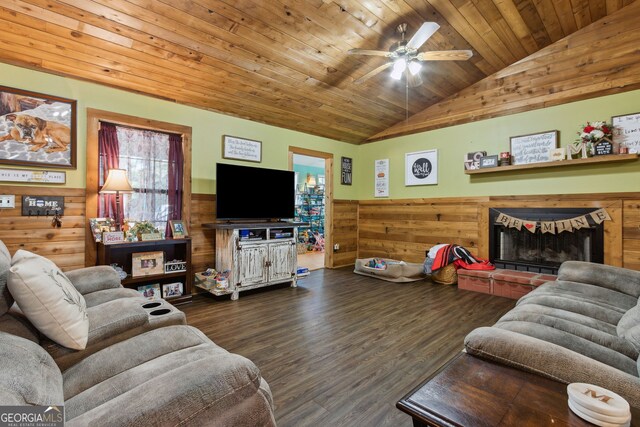 328 Willow Creek Rd, Folkston, GA 31537 - living room with wainscoting, lofted ceiling, wood walls, wooden ceiling, and a brick fireplace