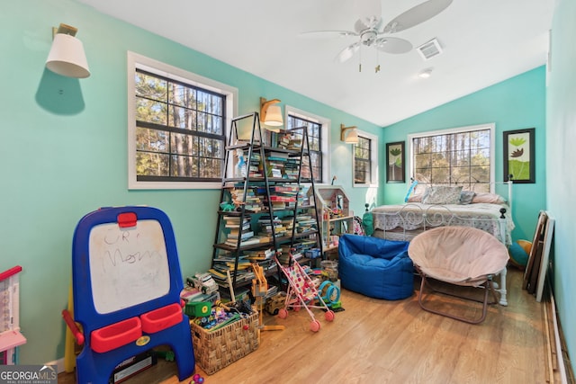 328 Willow Creek Rd, Folkston, GA 31537 - bedroom featuring wood finished floors, multiple windows, vaulted ceiling, and a ceiling fan