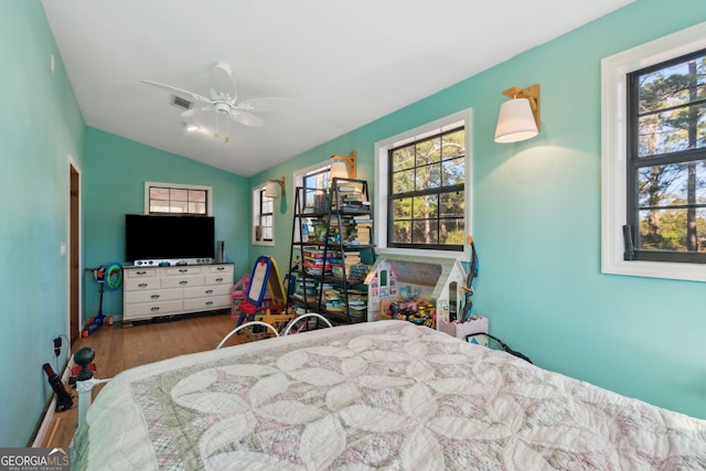 328 Willow Creek Rd, Folkston, GA 31537 - bedroom featuring wood finished floors, multiple windows, and vaulted ceiling