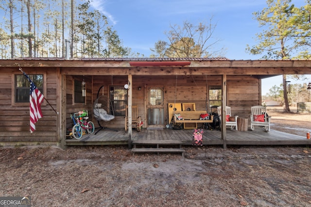 328 Willow Creek Rd, Folkston, GA 31537 - rear view of property with metal roof and a deck
