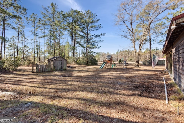 328 Willow Creek Rd, Folkston, GA 31537 - view of yard with a shed, a playground, and an outdoor structure
