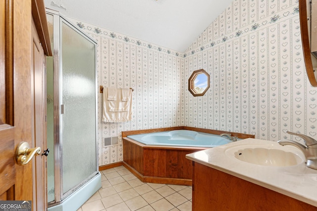 full bath with vaulted ceiling, tile patterned floors, a shower stall, a garden tub, and wallpapered walls