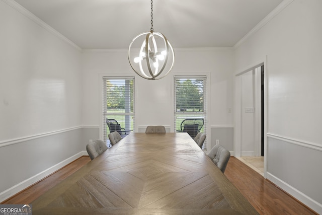 885 Kelleytown Rd, Mcdonough, GA 30252 - dining space with a chandelier, crown molding, baseboards, and wood finished floors